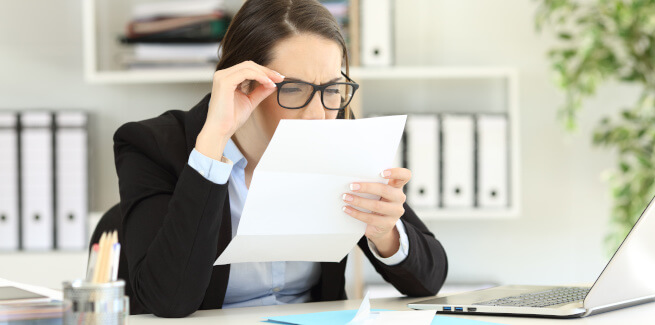 Woman having a hard time reading