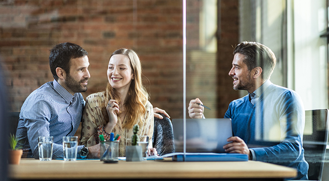 couple meeting with mortgage broker about asset finance